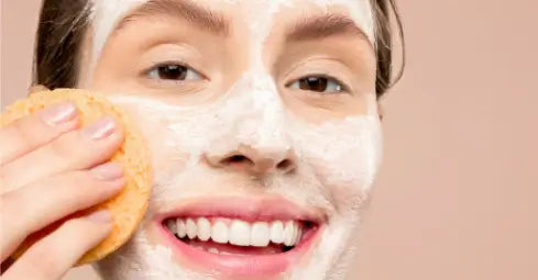 woman cleansing face